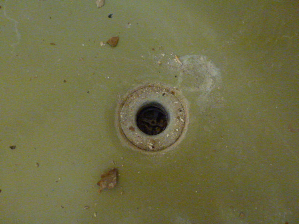 The old drain refused to come out.  The small cross pieces in the drain that are used to unscrew the drain simple broke free from the drain instead of turning it.