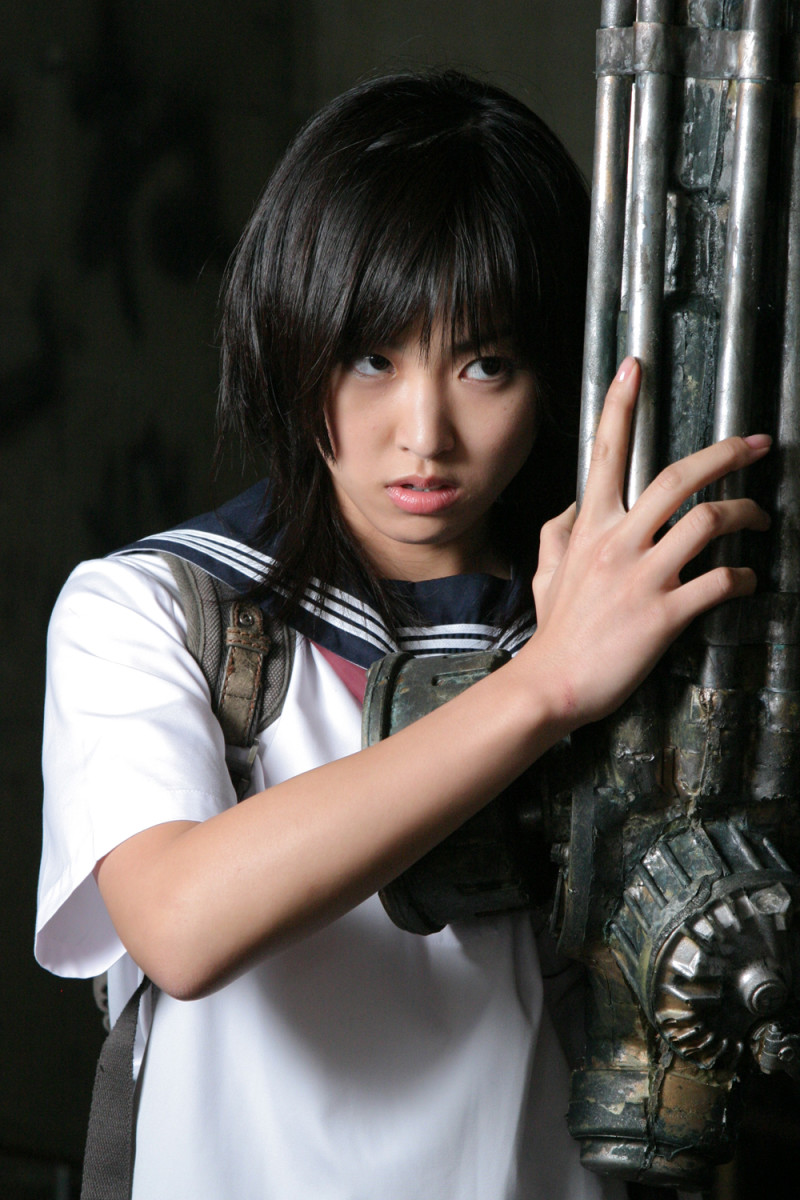 Ami Hyuga (Minase Yashiro) and her machine gun arm in, "The Machine Girl."