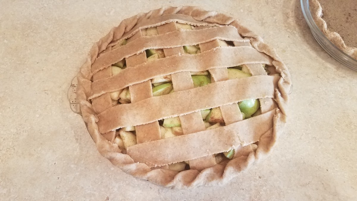 I finished the pie by rolling the two crusts together around the outside. You could do the same with a solid top crust, but make sure to cut vents into the top if you choose not to basket weave. Sprinkle some sugar over the top and bake for 45 min.