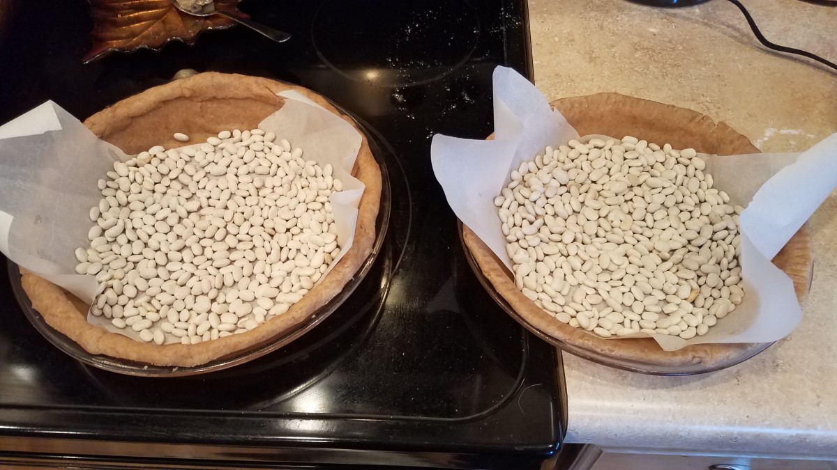 Because this is a freezer pie, you'll want to bake it your crust before filling it.I poked holes in the bottom of my crusts with a fork and partially filled them with dry beans so the crusts didn't bubble up in the oven.