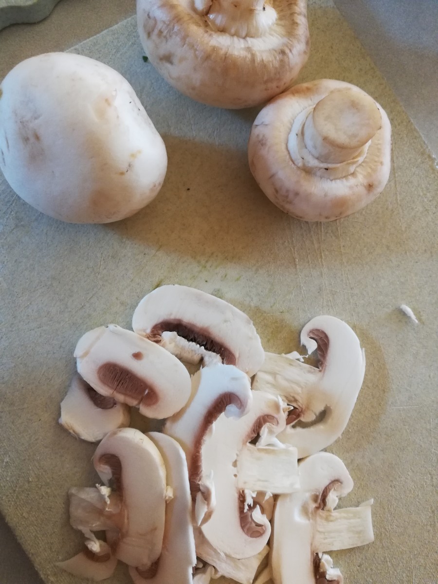 Slice the mushrooms like so, then slice in half down the stem and add them to the broth.