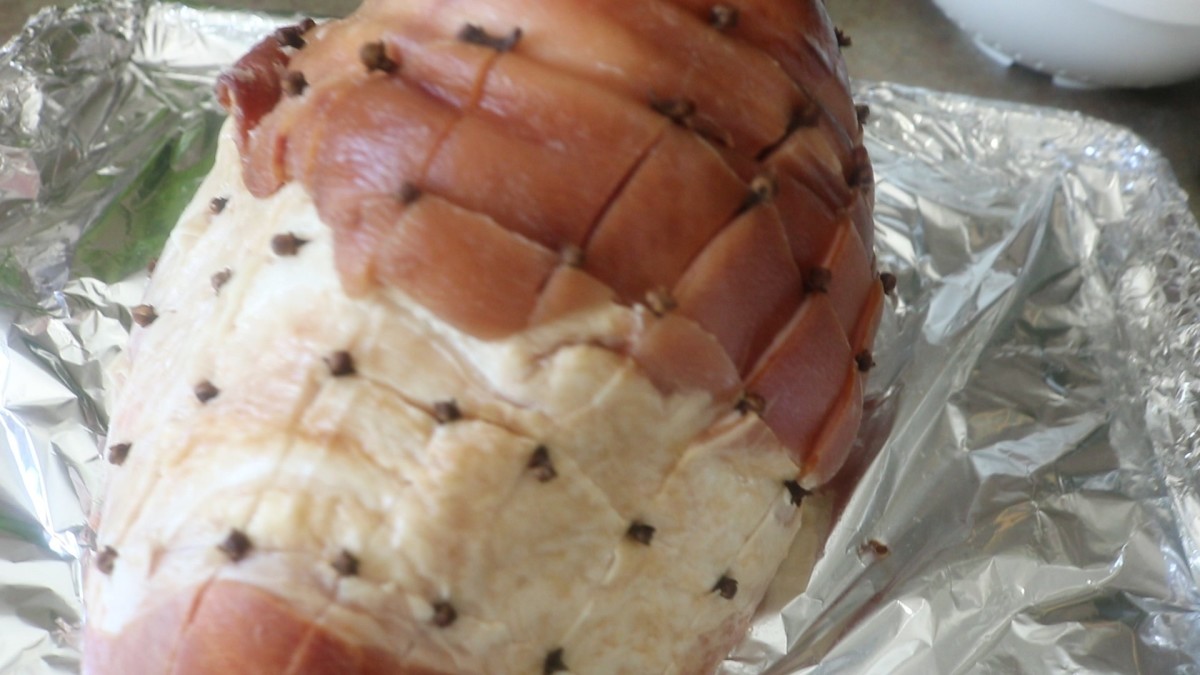 Use whole cloves to both decorate and perfume the ham - the cloves will season the ham as it cooks gently, and the finished product is simply pretty to look at!