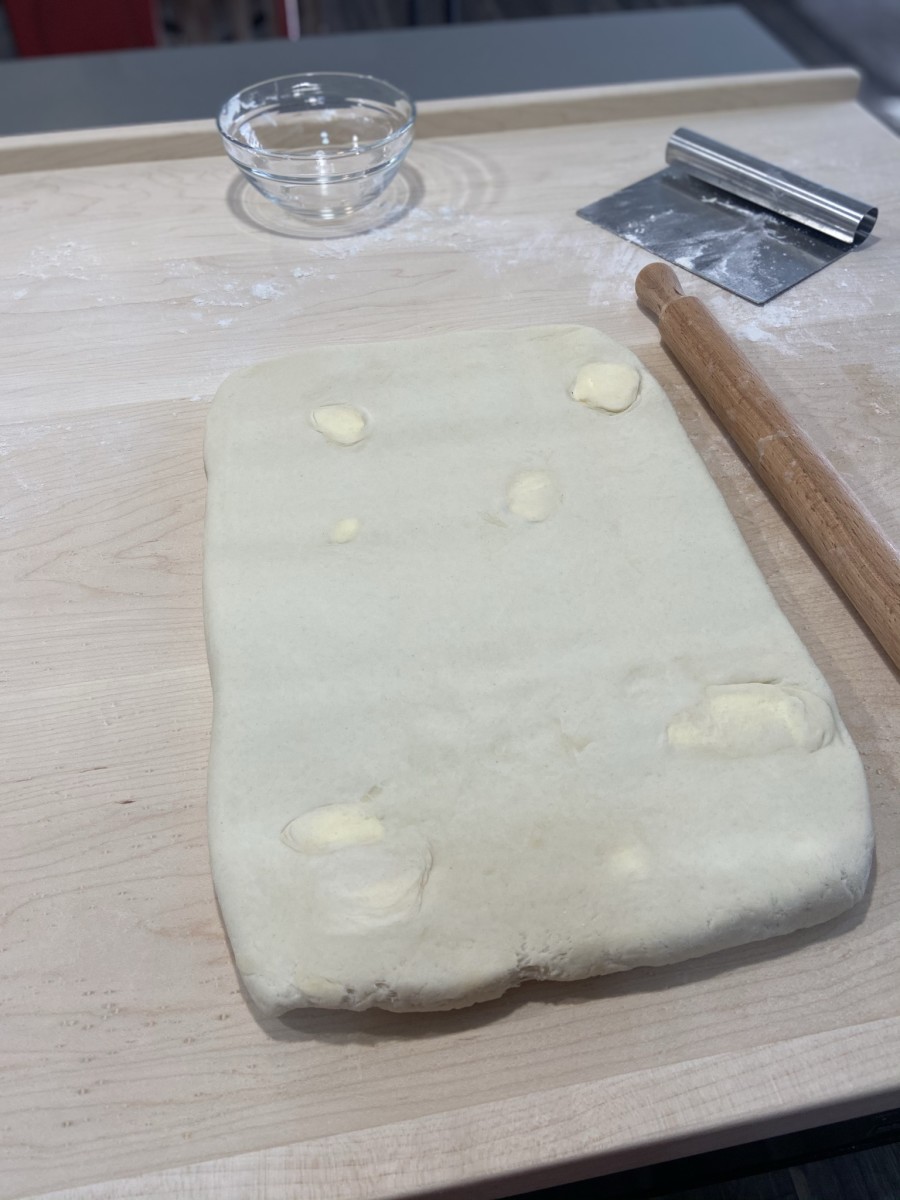 The third stage. After 2 hours, roll out the dough into a rectangle shape. 