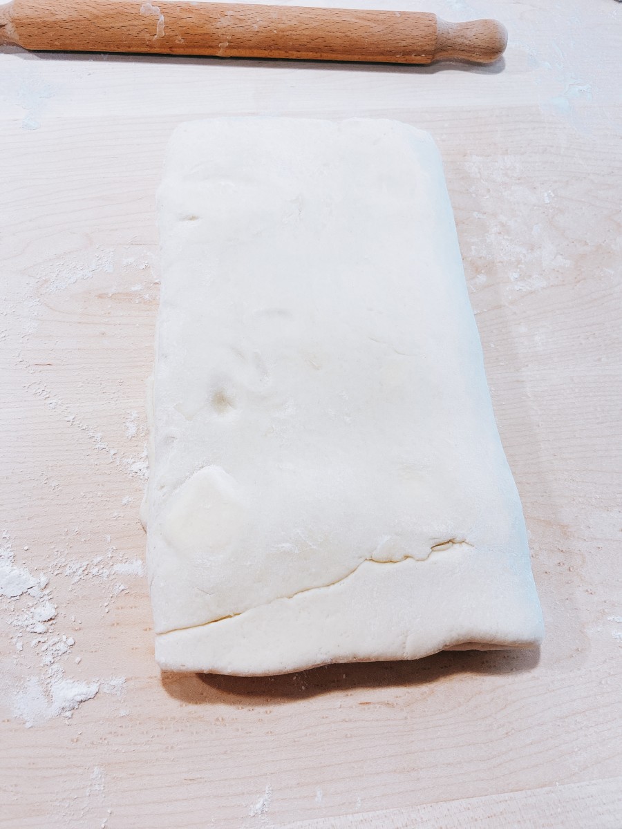 Turn the dough over and fold it into thirds.