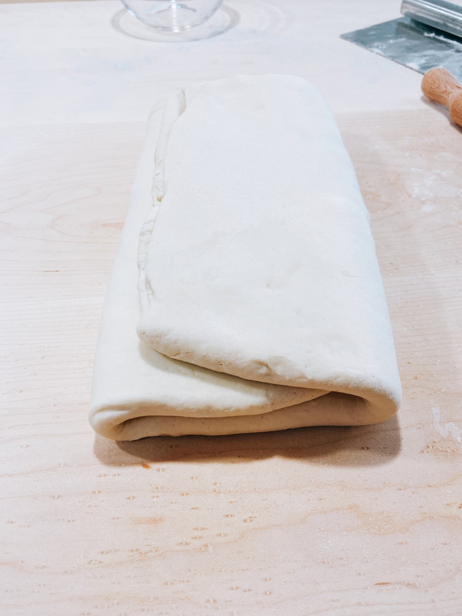 Turn the dough over and fold it into thirds. 