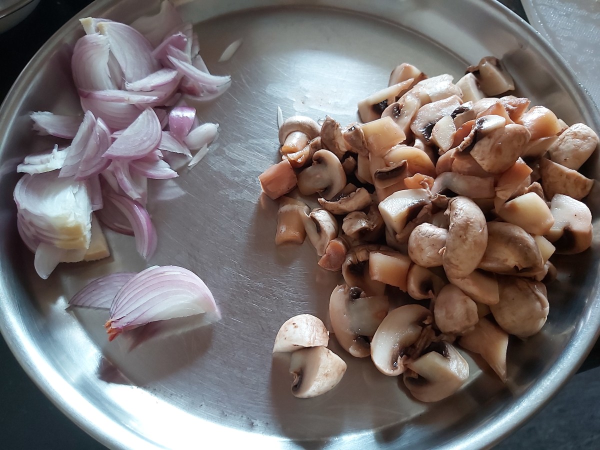 Peel and slice the onions. Wash, clean and chop the button mushrooms. Set aside.
