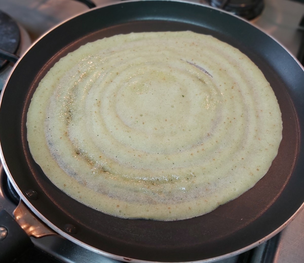 When the dosa is done, transfer it to a serving platter (add more cooking time for roast dosa). Repeat the same procedure with the remaining batter.