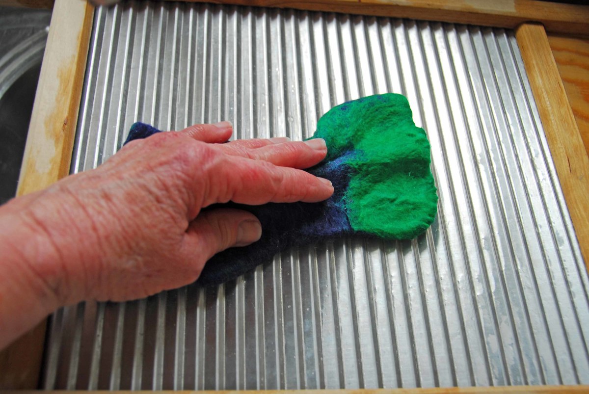Shrink the fibers by rubbing them well on a draining board.