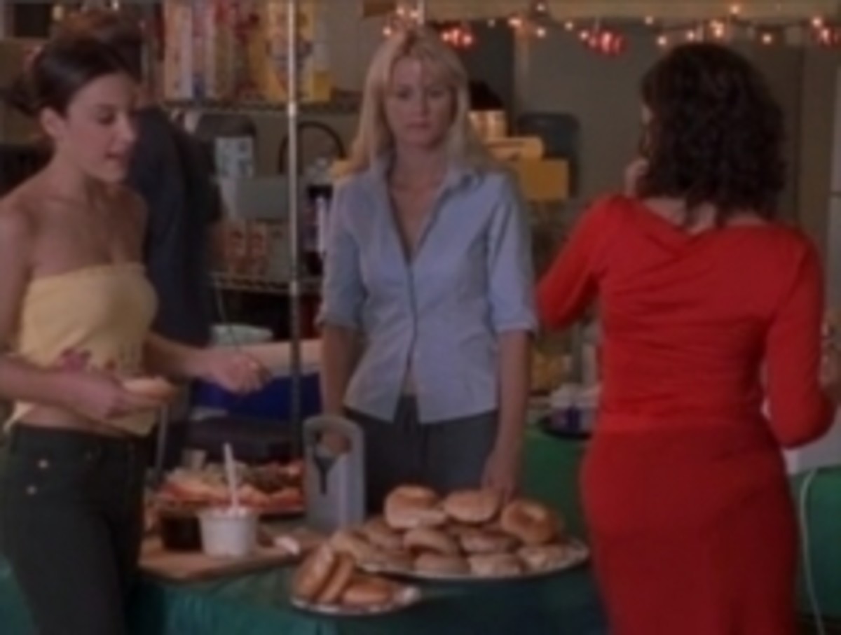Marcy (Lindsay Sloane-l) and Courtney (Bonnie Somerville) fatten up Hunter (Irene Molloy) at the craft service table.