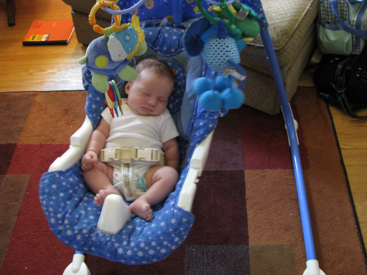 My son with our first Fisher Price swing. 