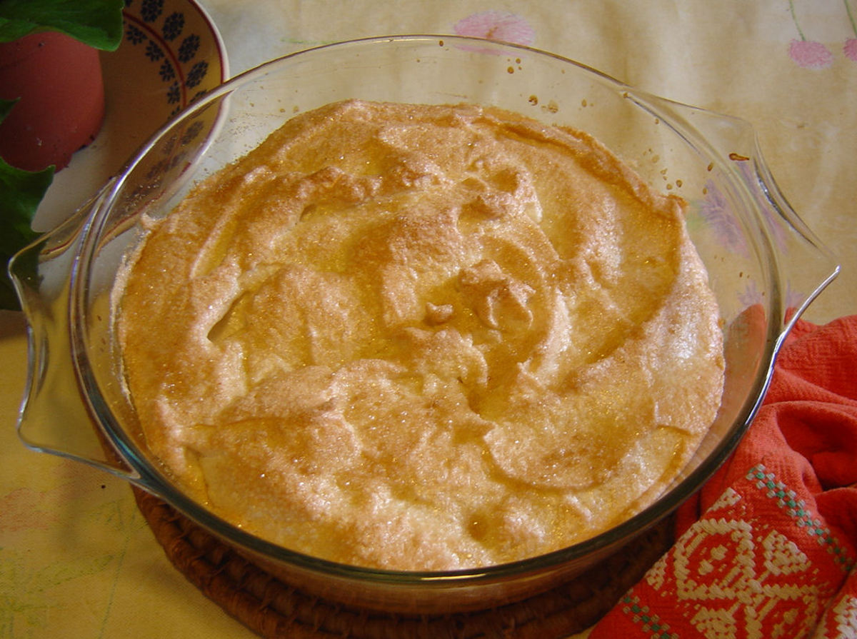 The pudding is cooked when the top turns golden brown and slightly crispy