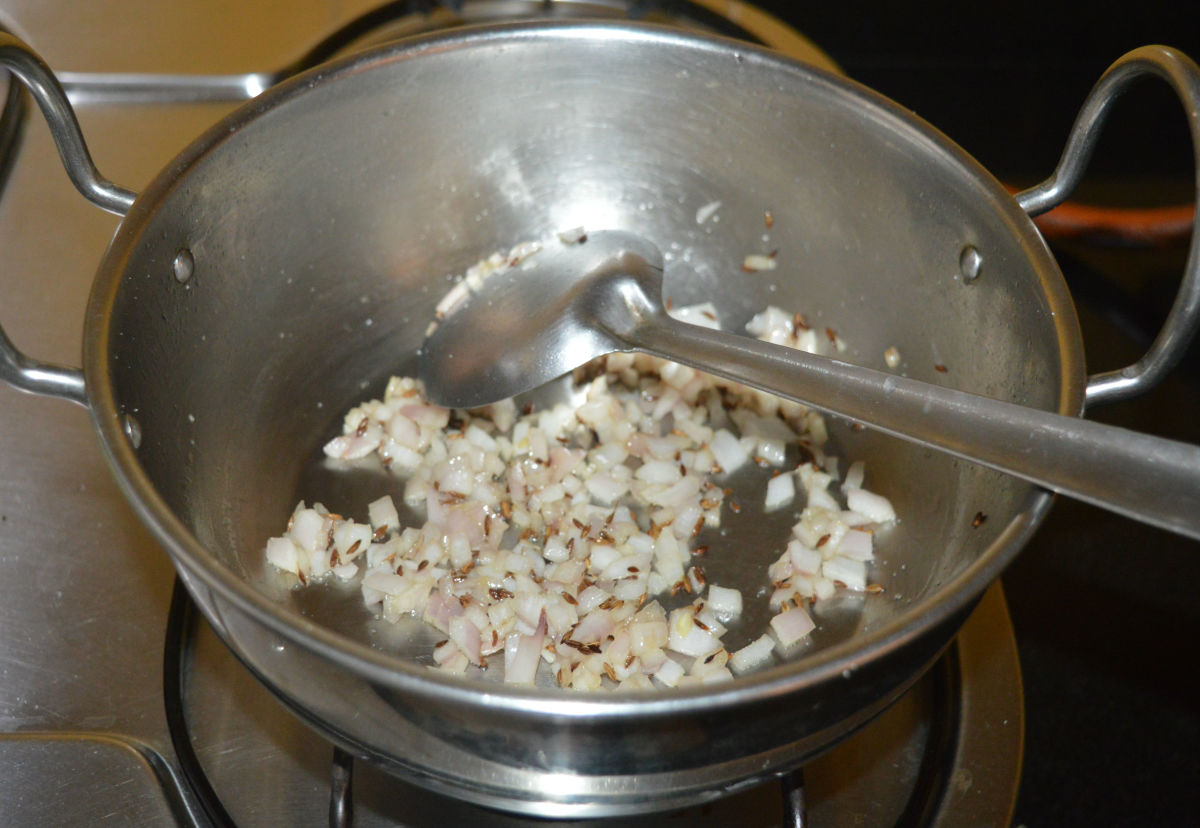 Add chopped onions. Keep the heat at medium. Saute the onions until they become pinkish.