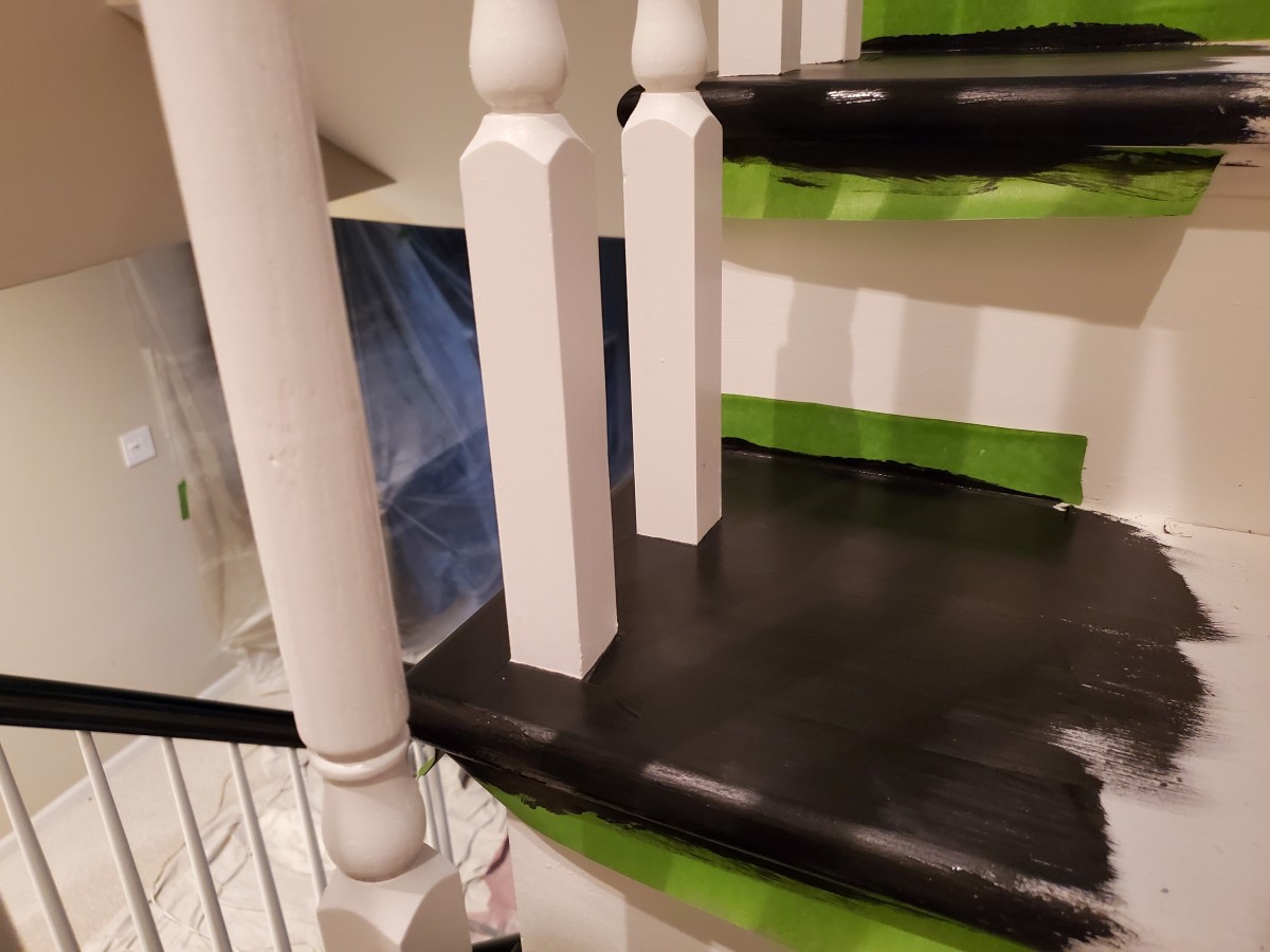 Painting stairs with black floor enamel.
