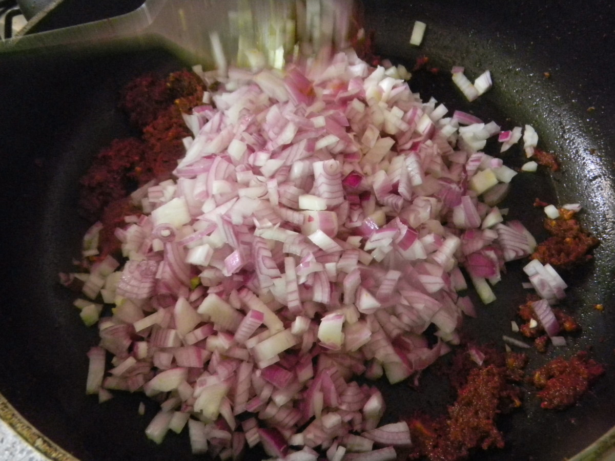 Add the onions to saute in the frying pan. Be careful not to burn.