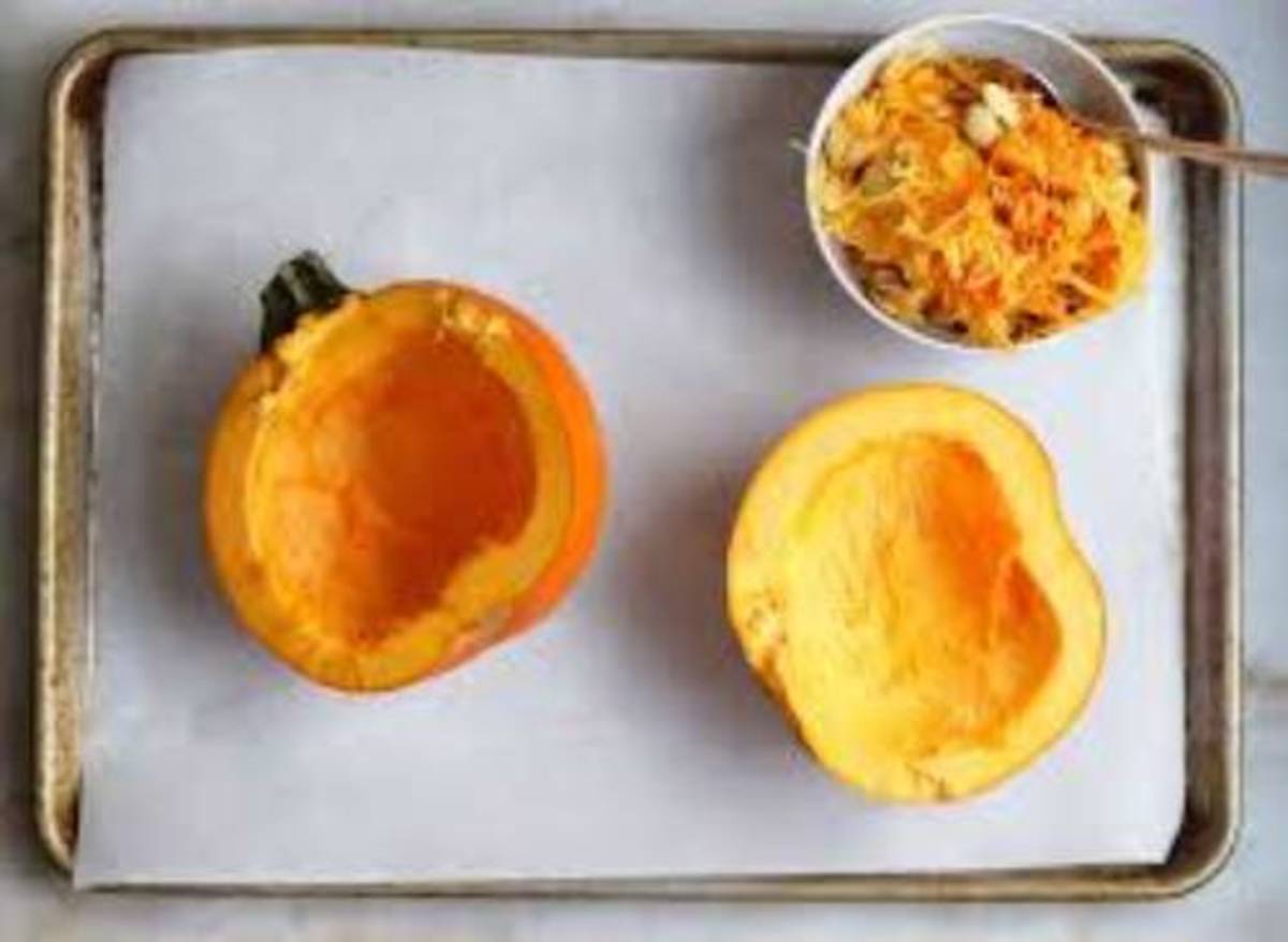 Place on a baking sheet to cut the half on the small pumpkin.   