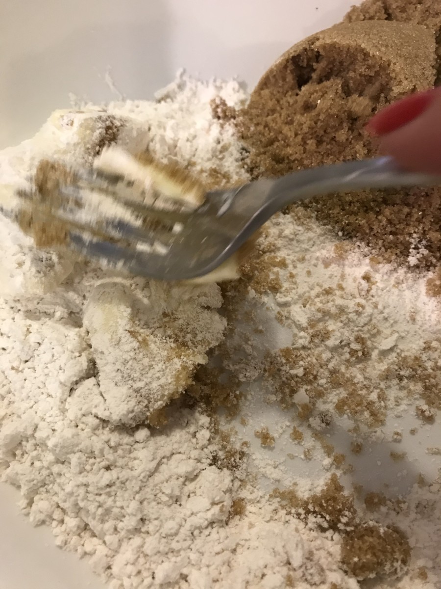 Use a fork to mash softened butter into the flour and brown sugar before stirring in the pecans. You're looking for a coarse, crumbly texture.