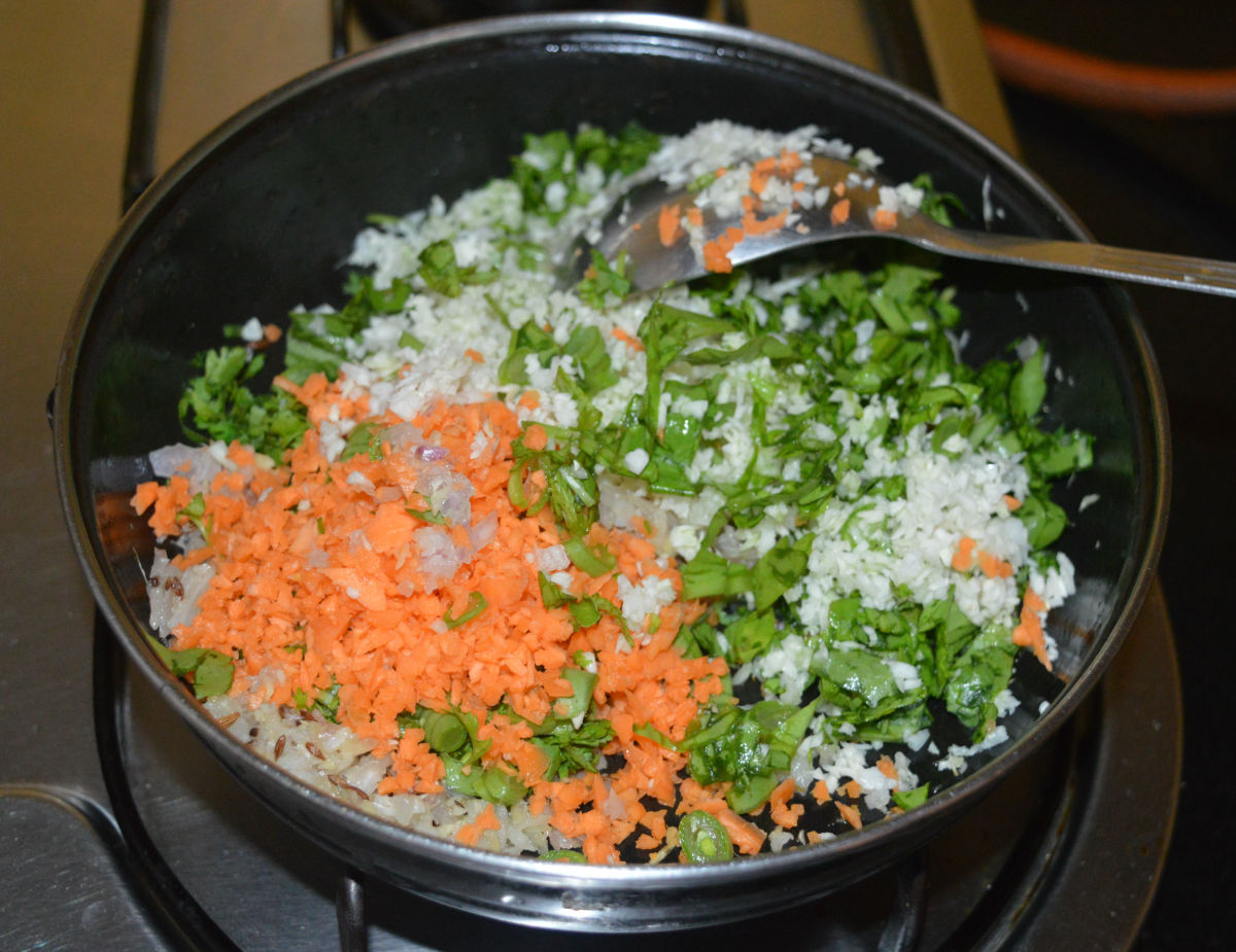 Add all of the chopped veggies and some salt. Saute for 2-3 minutes on high heat.