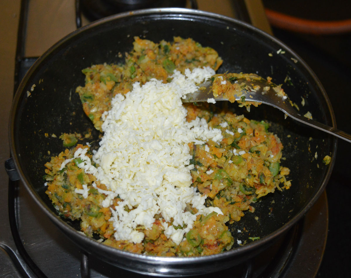 Add grated paneer and mix well. Add the remaining salt, if any, and mix. Turn off the heat.