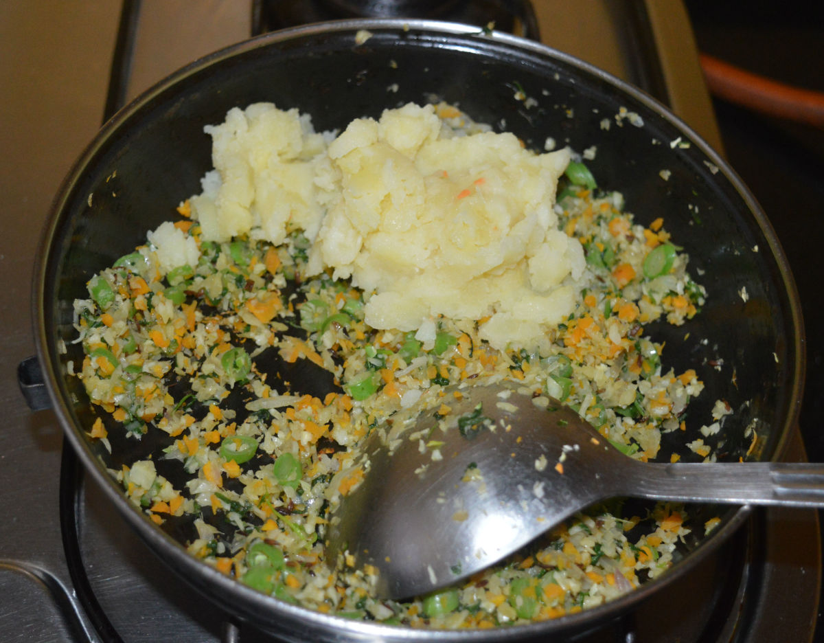 Reduce heat. Add mashed potato and mix well.
