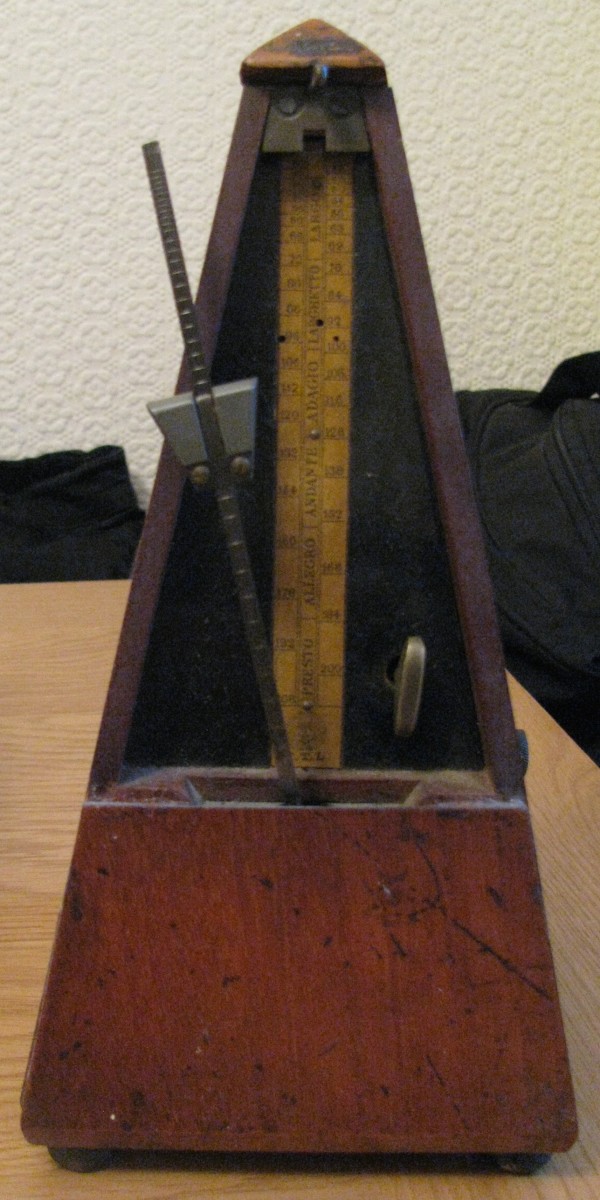 Pendulum with Weight and Key - Behind on the yellow strip, are the Italian terms for the Varied Speeds; Allegro etc.