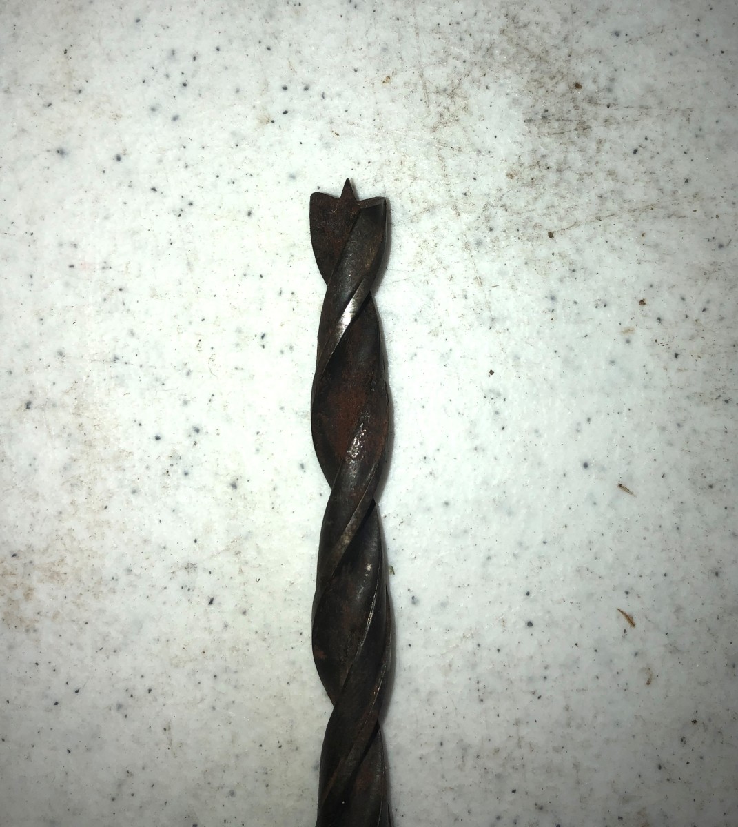A brad point drill bit designed for soft woods. Notice the rounded spurs.