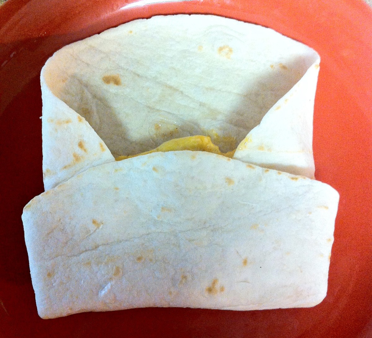 Fold the bottom of the tortilla into the middle.