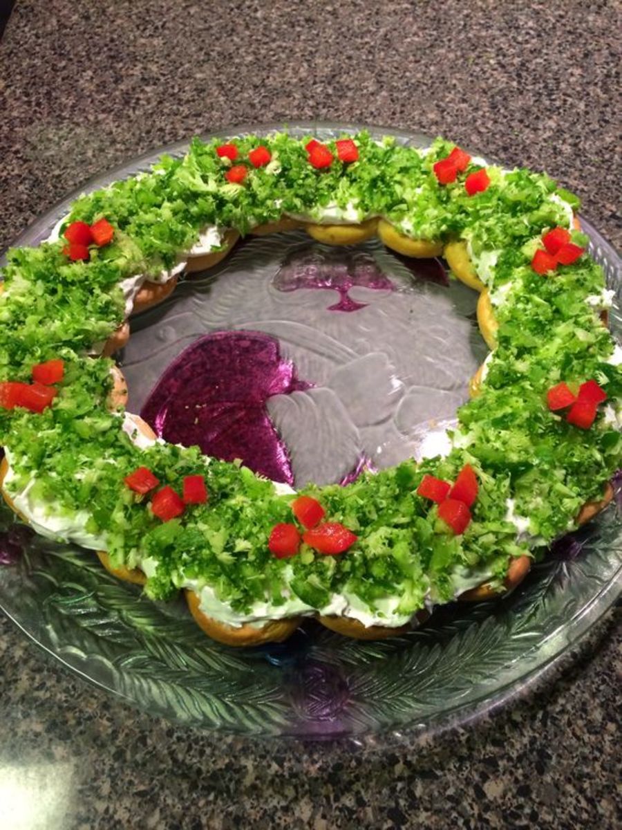 This Christmas wreath bread is garnished with beautiful red and green vegetables.