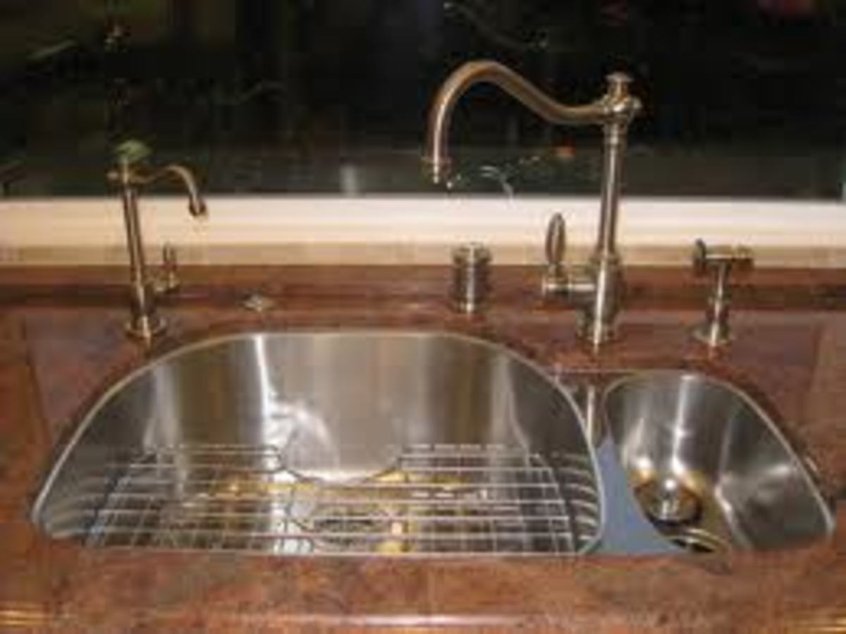 Beautiful food preparation sink and faucet with filtered water mounted under the kitchen counter top