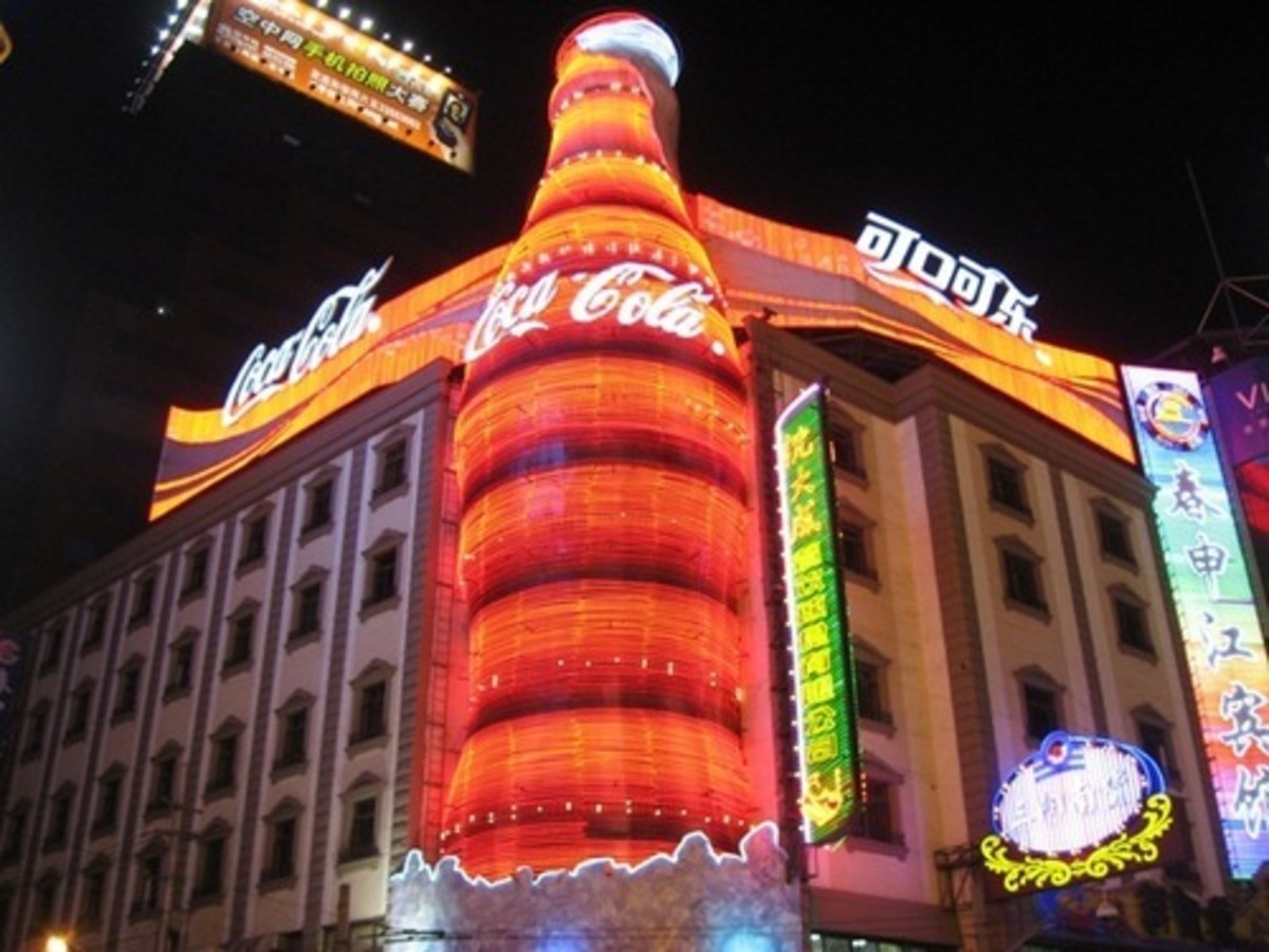 Above is the mother of all outdoor Coke Ads, A giant neon lit coca-Cola bottle in Red China's Shanghai. A very Multicultural picture indeed. This is 'the convergence' of capitalism and Marxism. It's like the merging of Dickens Hard times with Orwell'