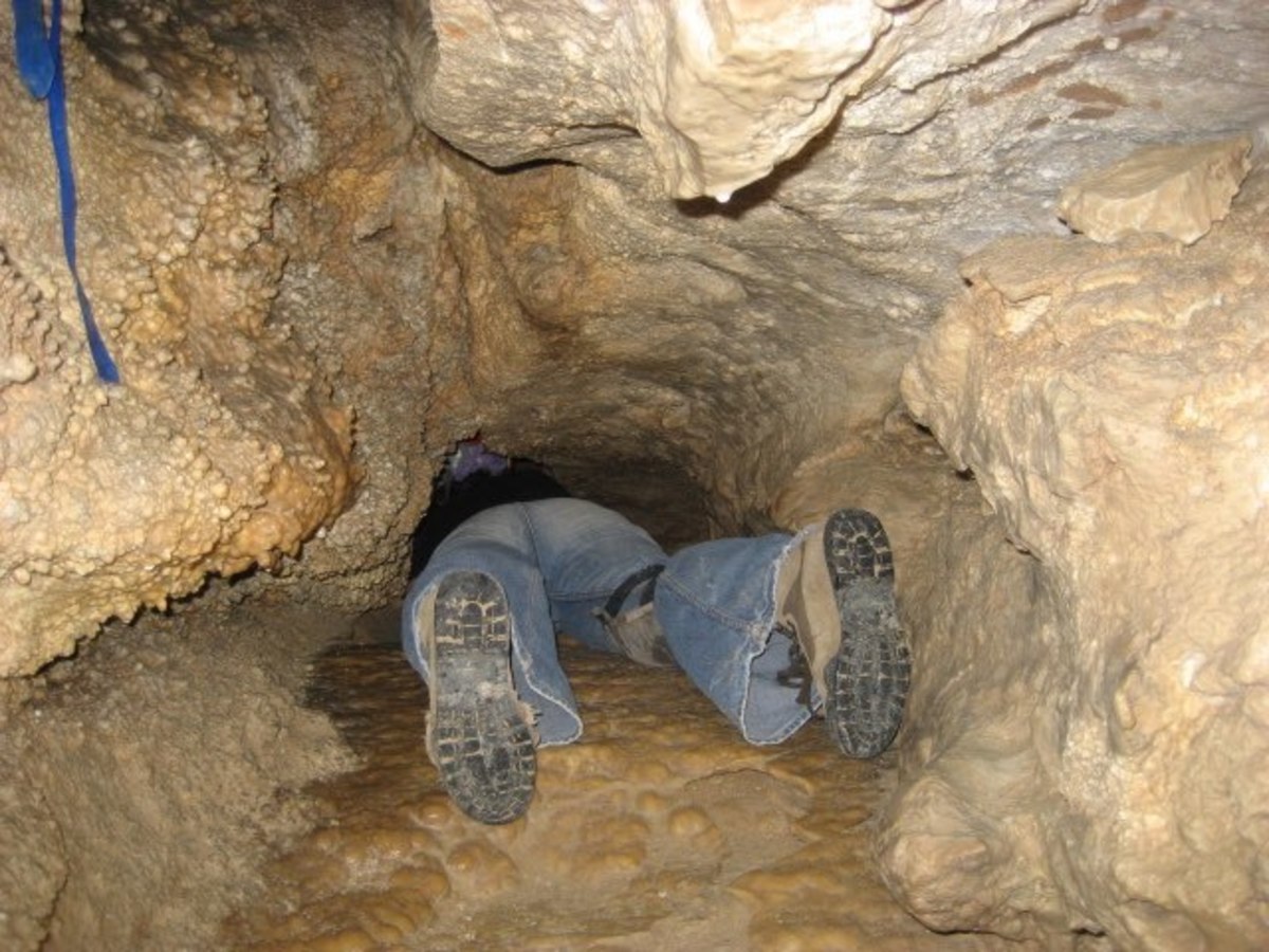 Spelunking: Crawling through underground caves.