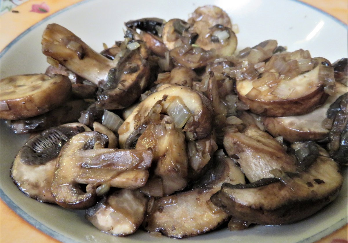 Cooked mushrooms and shallots removed to a dish