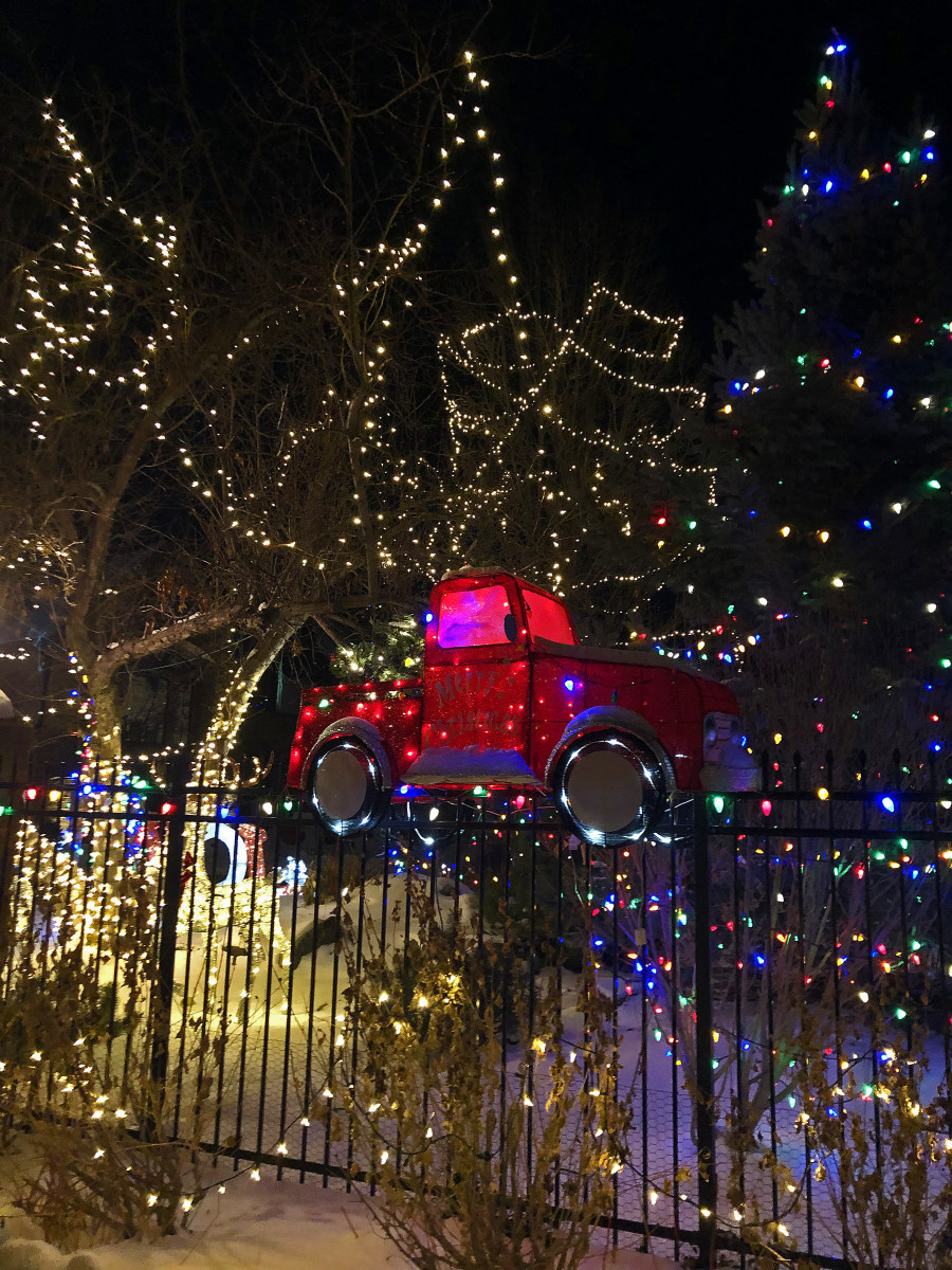 Here I focused on just one aspect of the decorations, a little red truck situated in front of the gates.