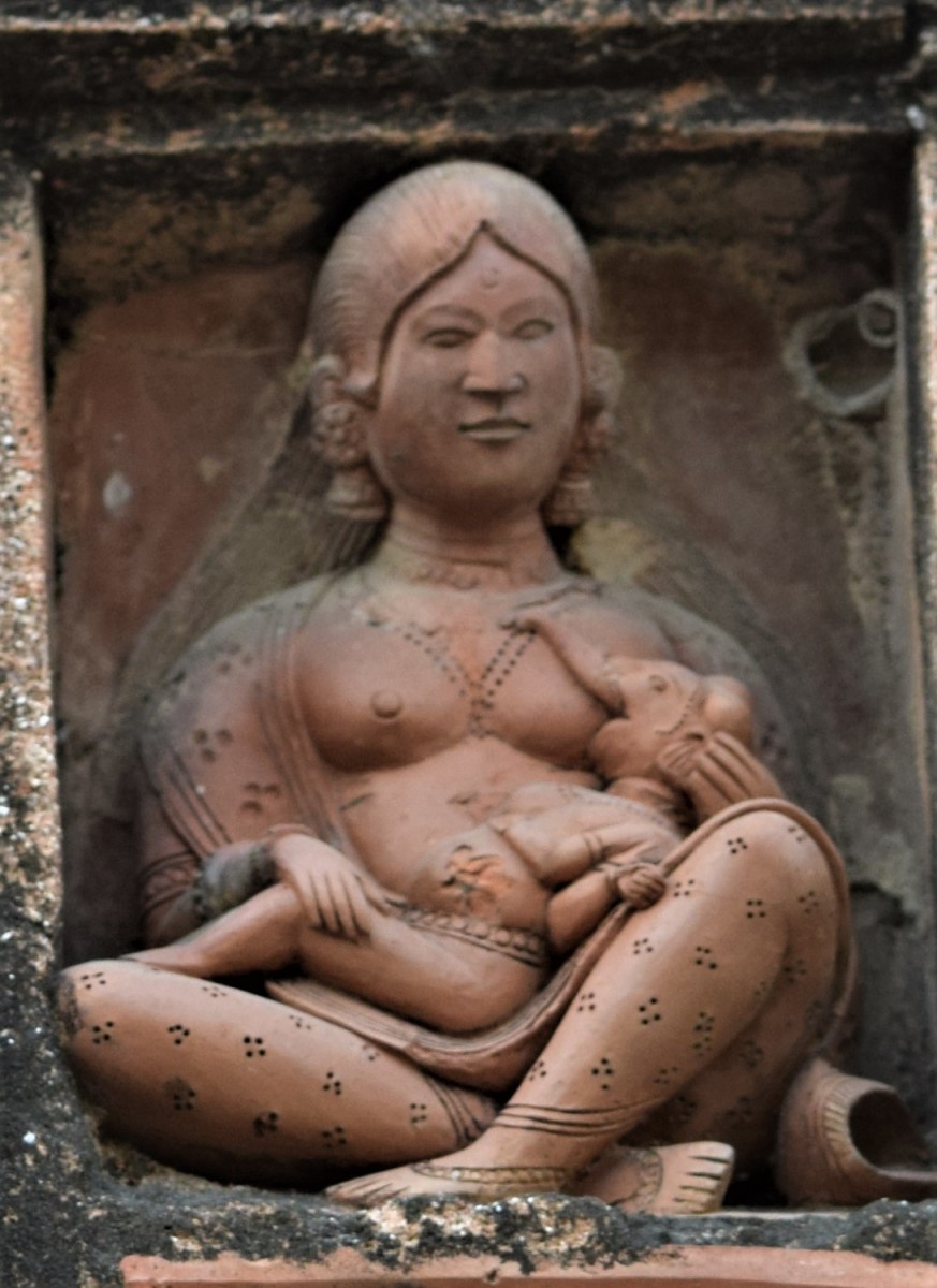 Goddess Durga breastfeeding baby Ganesha; Terracotta decoration, Lakshmi Janardan temple, Ghurisha 