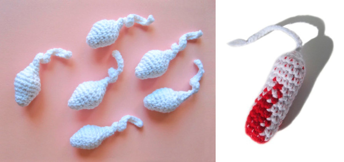 Crocheted cat toy sperm and a pretend bloodied cat toy tampon.