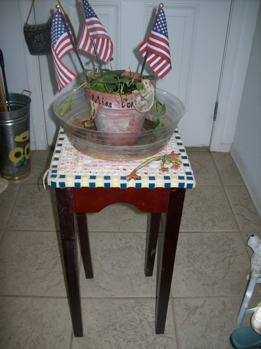 Discarded table with a broken leg - sometimes furniture made out of pressed board or composites are salvagable.