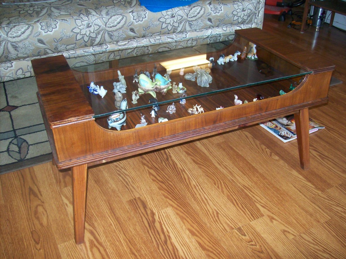 Grandma's coffee table that had been left outside. Cost: $2.50 small can stain and $2.50 small can of varnish. Oh, elbow grease, priceless.