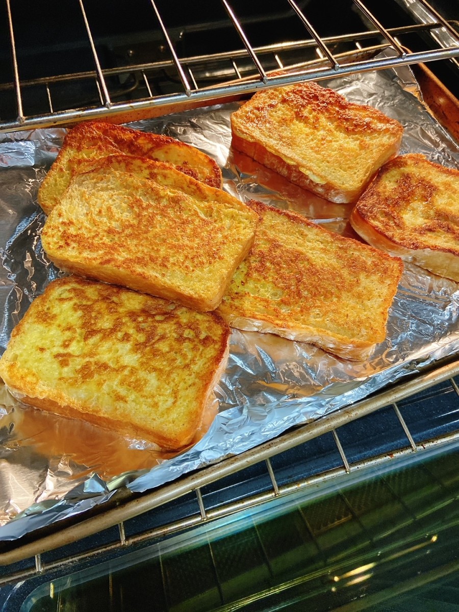 After the first batch, let the French toast sit on foil or a pan in the oven to keep it warm before serving. 