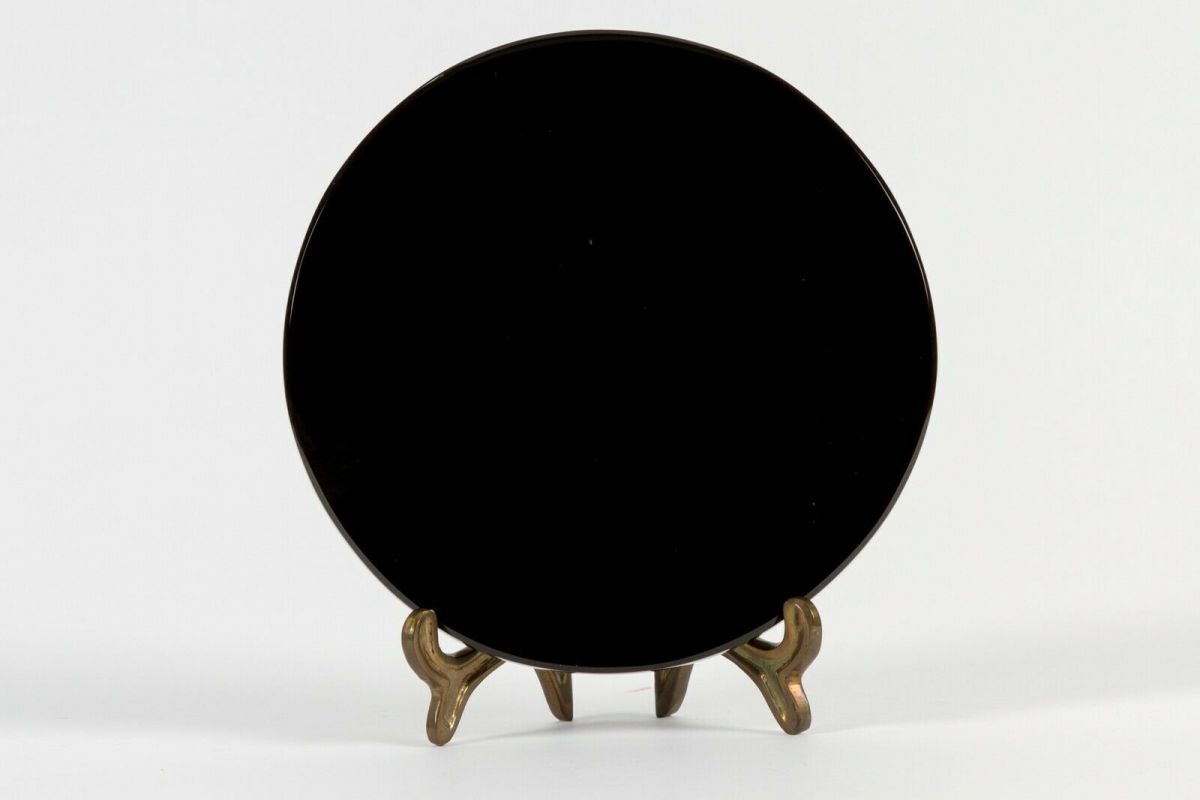 A scrying mirror. This one is made of obsidian.