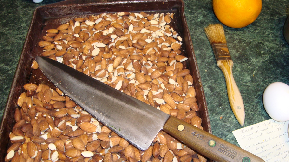 Chopping the toasted almonds.