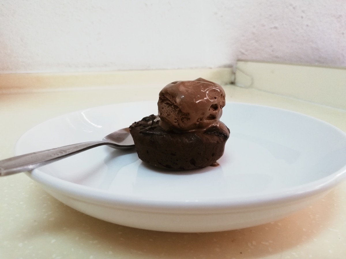 Chocolate lava cake, topped with some chocolate ice cream. 