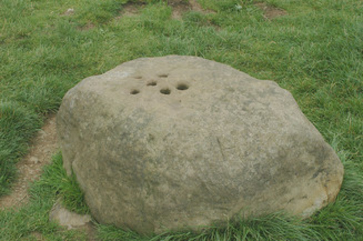 The Boundary Stone with holes drilled into the top to fill with vinegar to disinfect coins. 