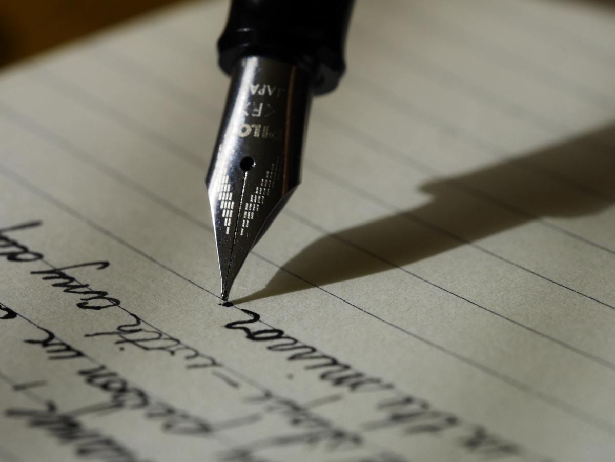A writer using a fountain pen.