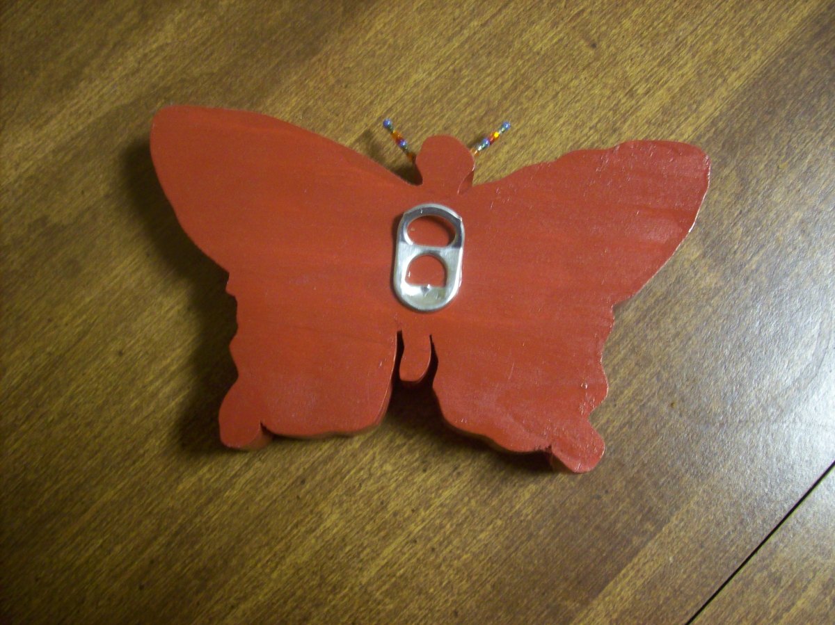 Wooden butterfly with aluminum pop top hangar