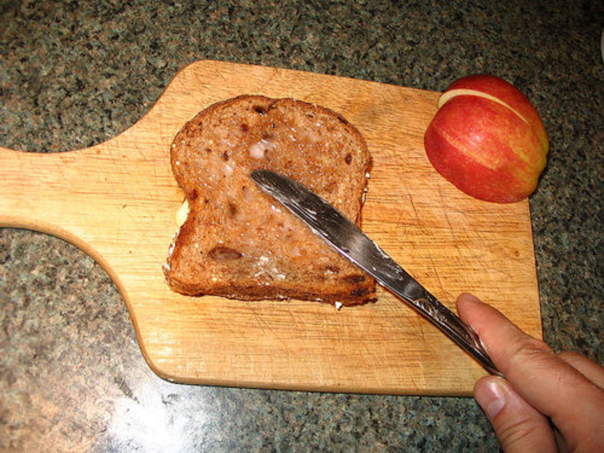 Spreading coconut oil on toast. http://www.flickr.com/photos/gudlyf/38075514/ under Creative Commons Attribution License