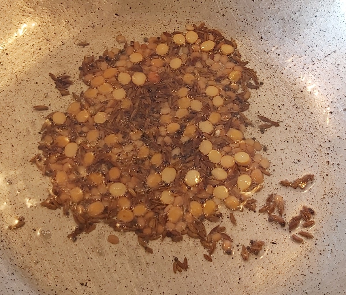 Fry the lentils over low flame till golden brown (take care not to burn the lentils).