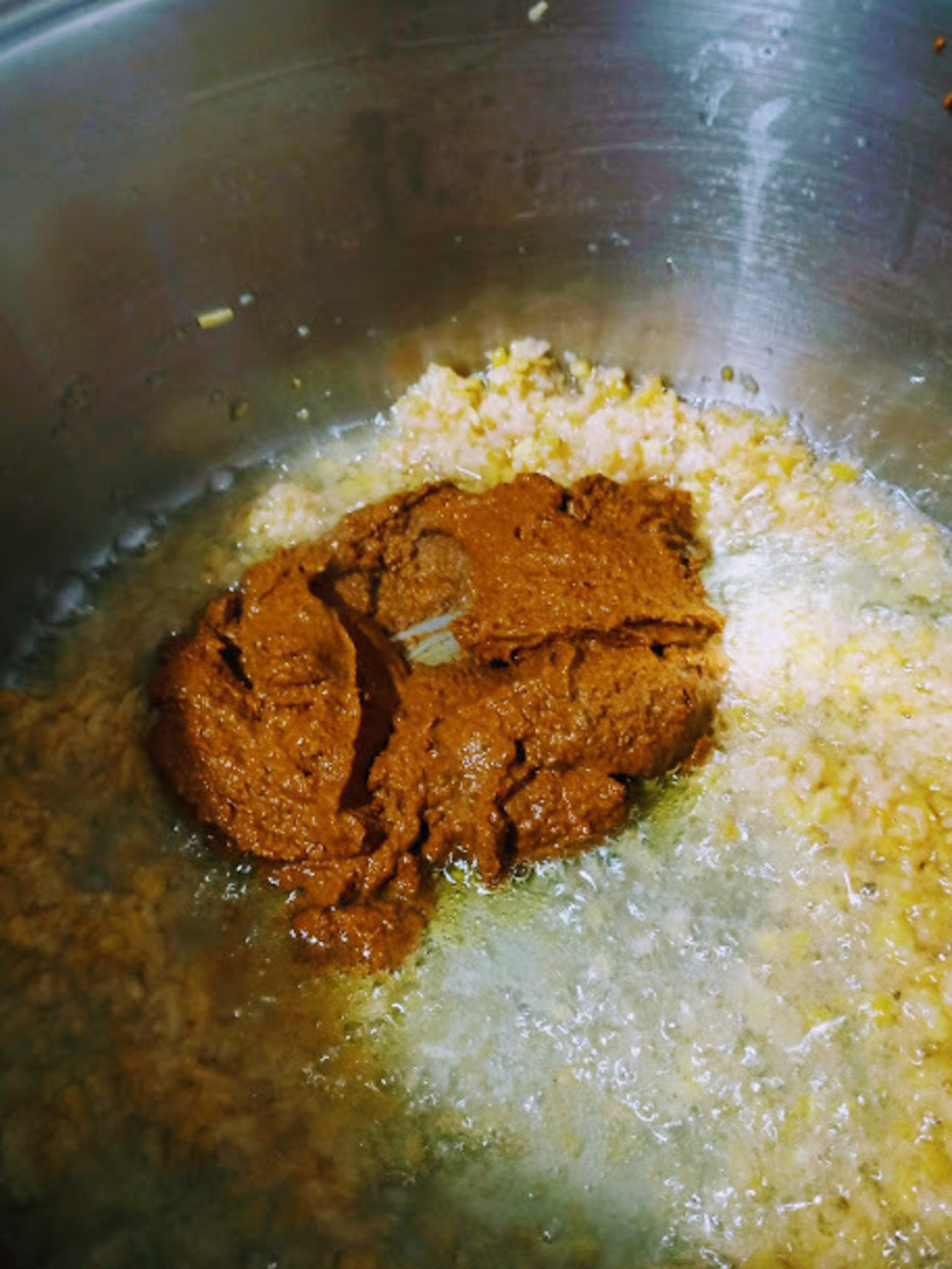 add another third of the oil, when hot add curry paste