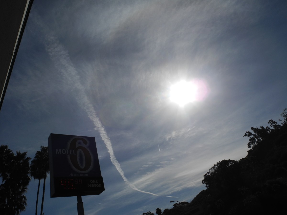 San Diego/  Approximately 10:30 am.  This is a chemtrail that is morphing into a larger cloud like construct, but shown against an already  Chemtrailed milky sky.  Notice the consistency of the clouds in the background is different to REAL Clouds.