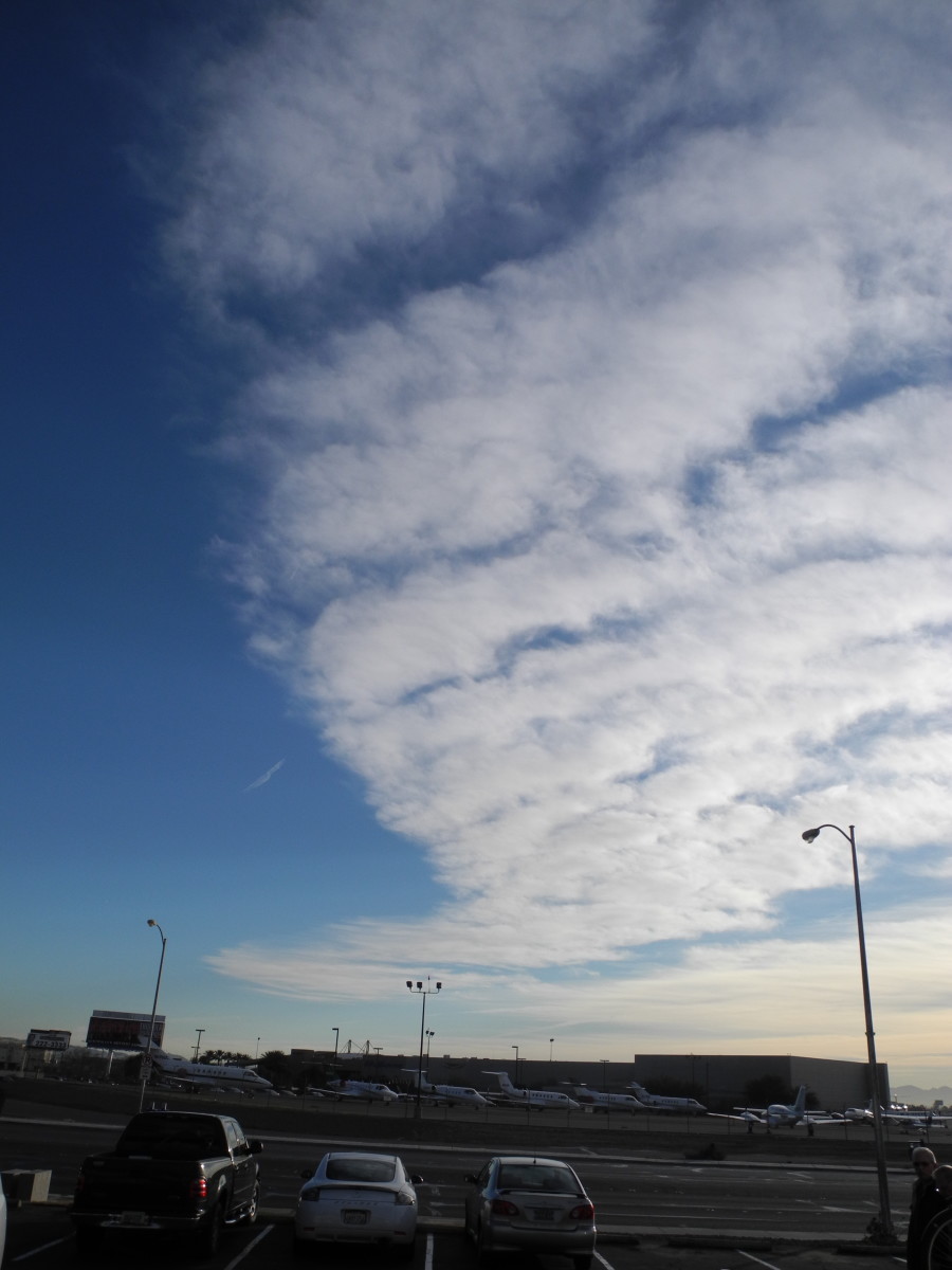 In a matter of about an hour or so, you have a completely EXPANDED Cloud-like formation.  If you didn't see the original Pencil Thin Line Aerosol Plane Fly By, then you could argue that "these are JUST Clouds"... no big deal.  (But they aren't).