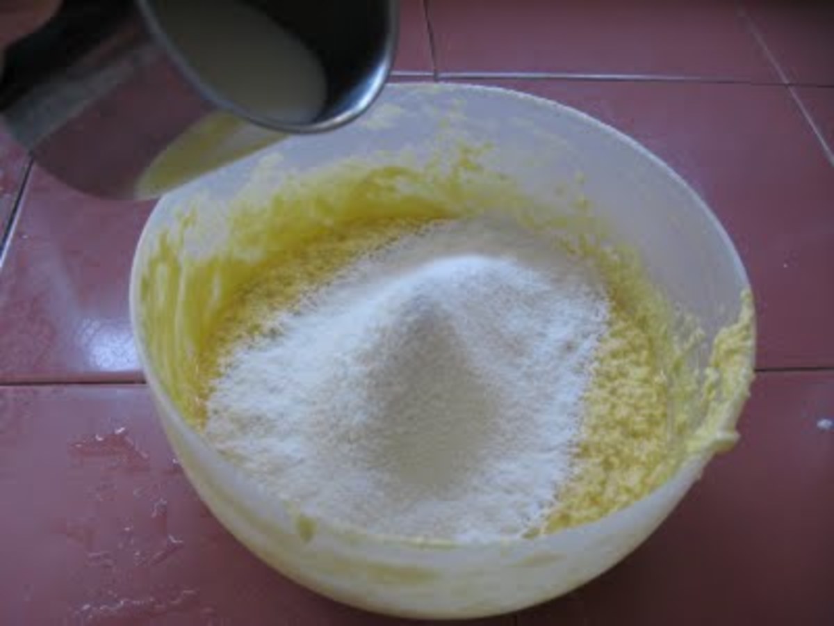 Sieve in the dry ingredients. Then, pour in milk gradually.
