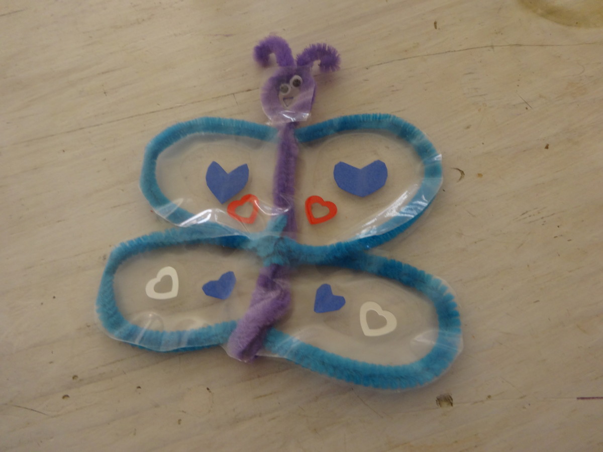 another version of a butterfly, using contact paper and decorations for the wings